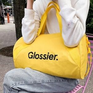 NWOT Limited Edition Yellow Glossier Duffle Bag
